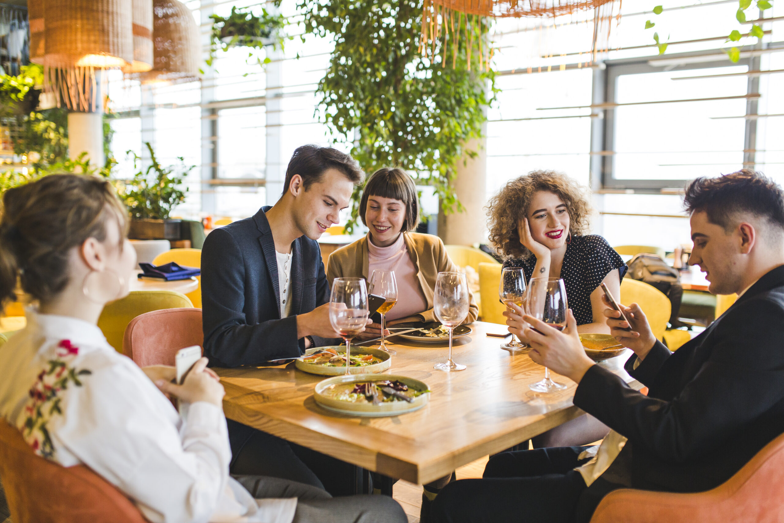 group-friends-eating-restaurant