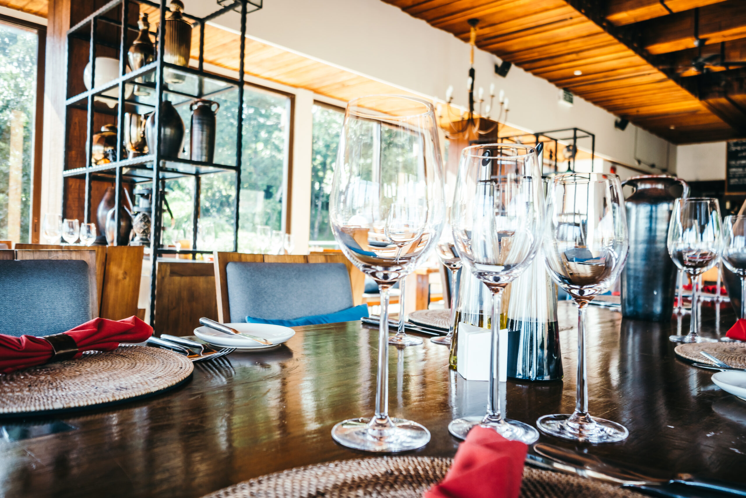 Selective focus point on Wine glass and table setting for dinner in luxury restaurant - Vintage Filter